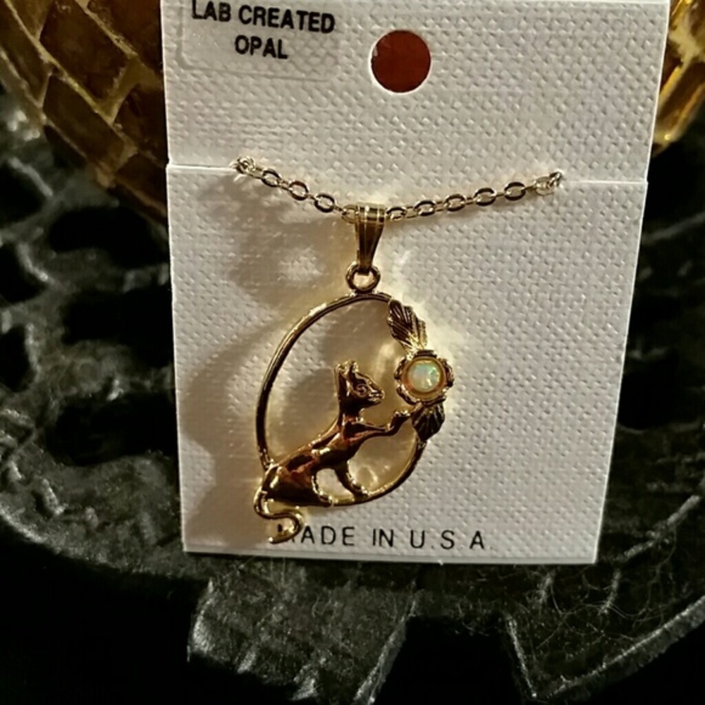 Gold necklace with cat, small opal stone